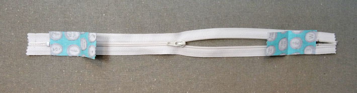 Zipper With Fabric Tabs in Place