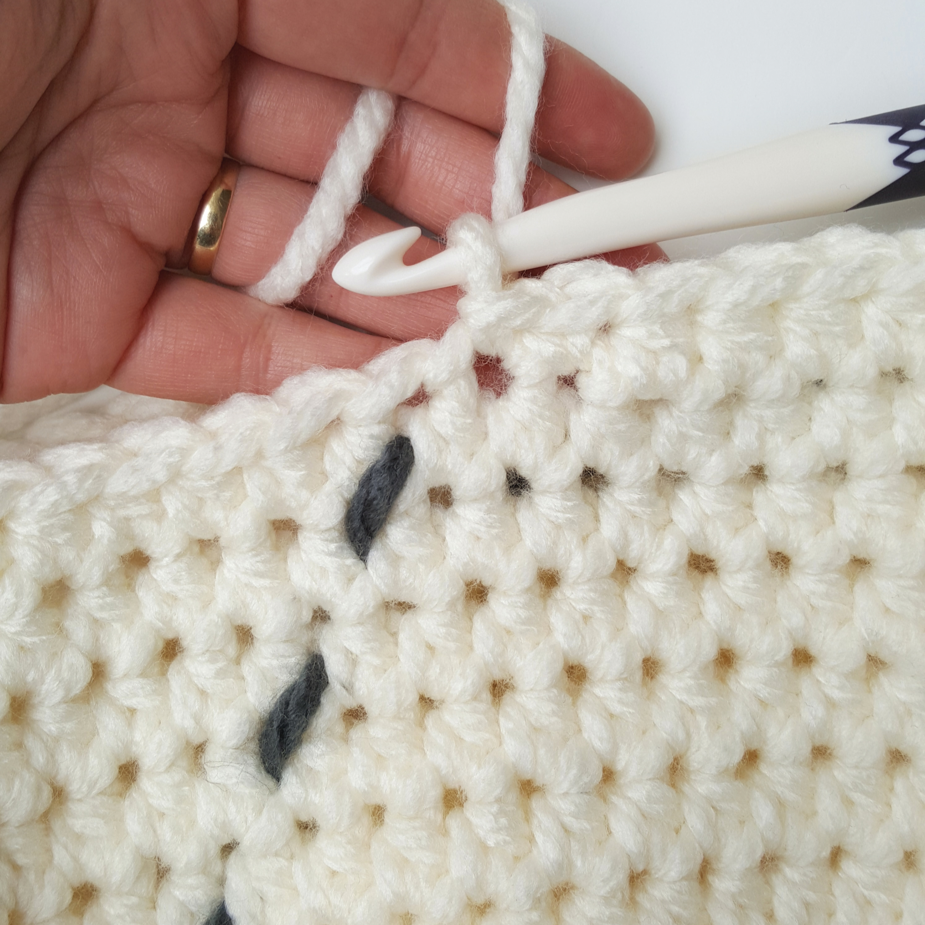 Crochet around with half-double crochets until you come to the last round of your basket