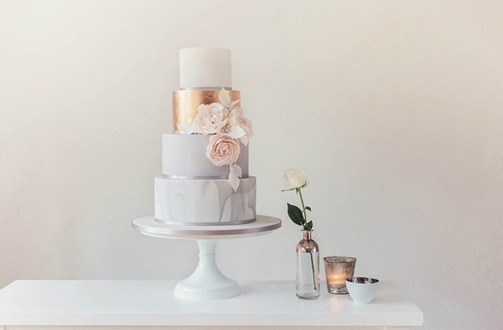 Rose gold and marble wedding cake by Poppy Pickering