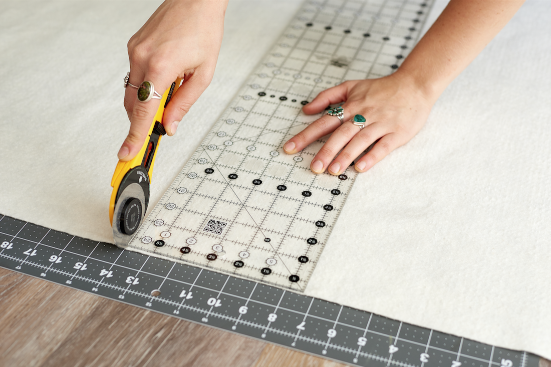 Cutting quilt batting with rotary cutter