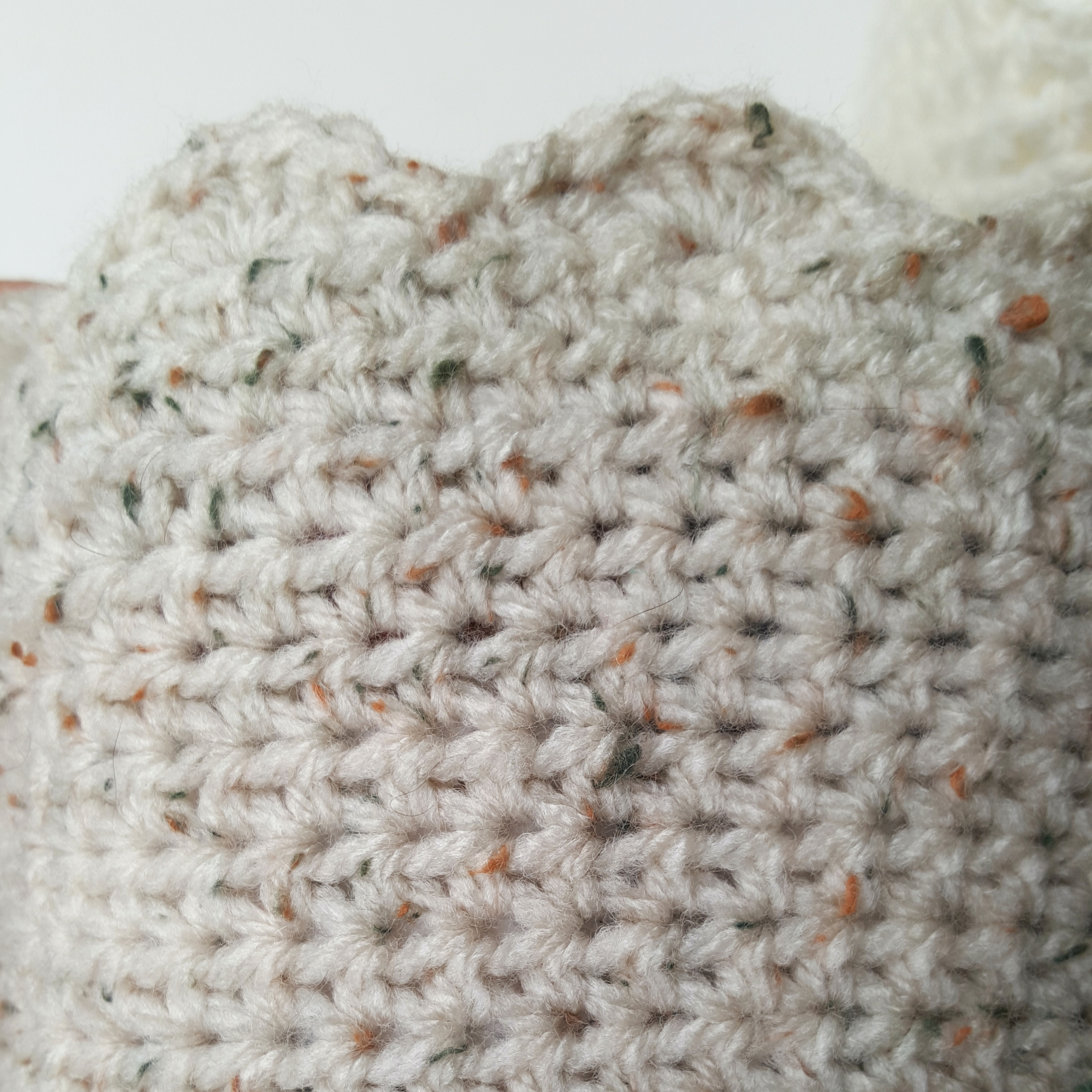 Flip a half-double crochet basket inside out to reveal the wrong side of the fabric.