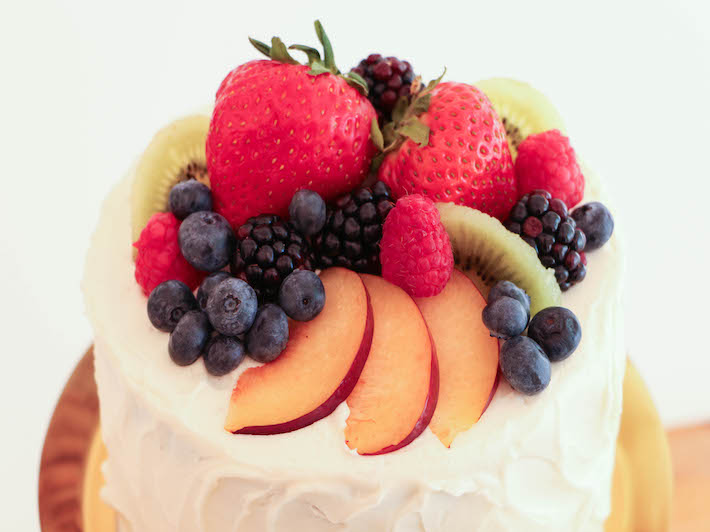 Decorating a Cake with  Fruit on Top
