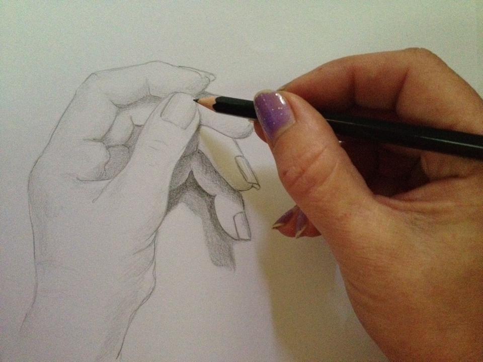 Hand drawing a hand