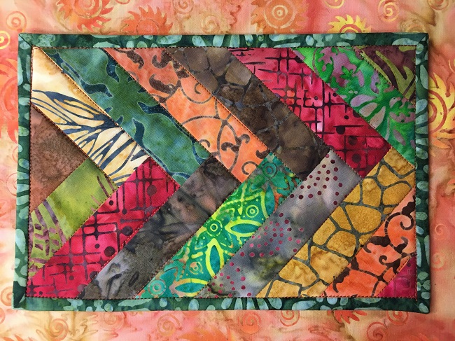 Batik Braid Mug Rug Quilted in the ditch