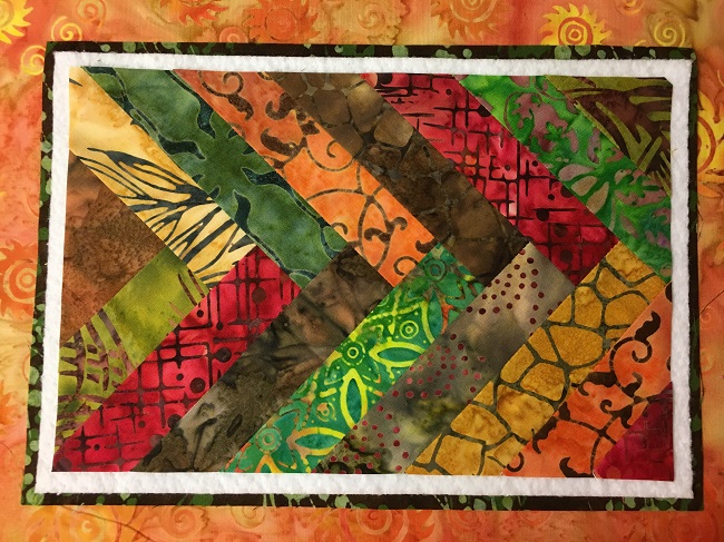 Batik Braid layered on backing and batting