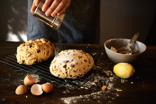 Sifting Powdered Sugar on Stollen Bread