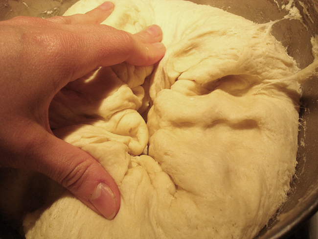 Punching bread dough