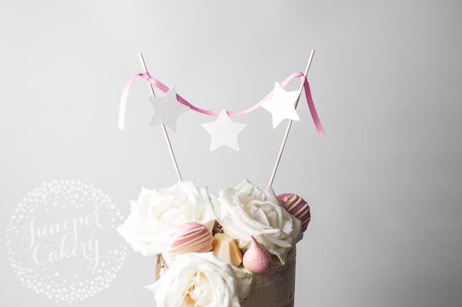 Create a bunting cake topper with ribbon