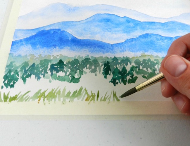 Grassy foreground in a watercolor mountains painting