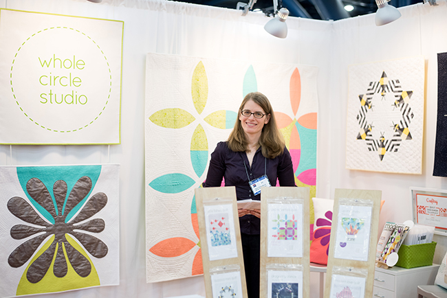 Sheri Cifaldi-Morrill in Her Quilt Market Booth