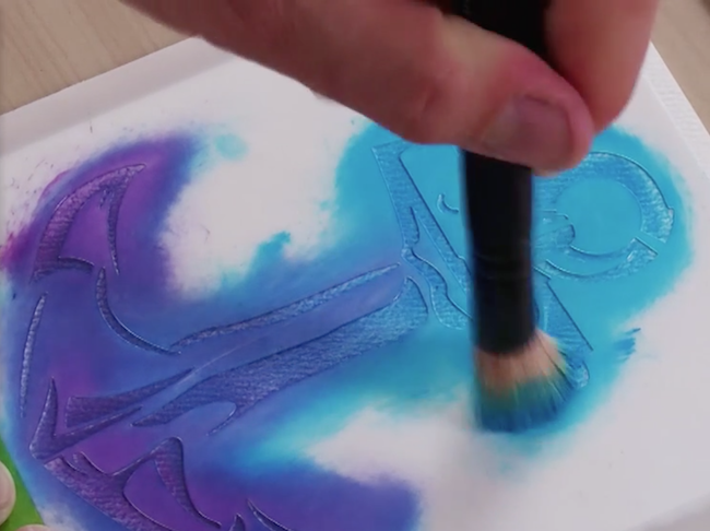 using a stencil brush to fill in a stencil