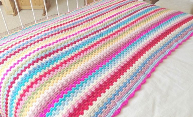 Granny stripe blanket as a bed cover