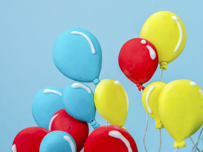 Balloons Arranged on Cake
