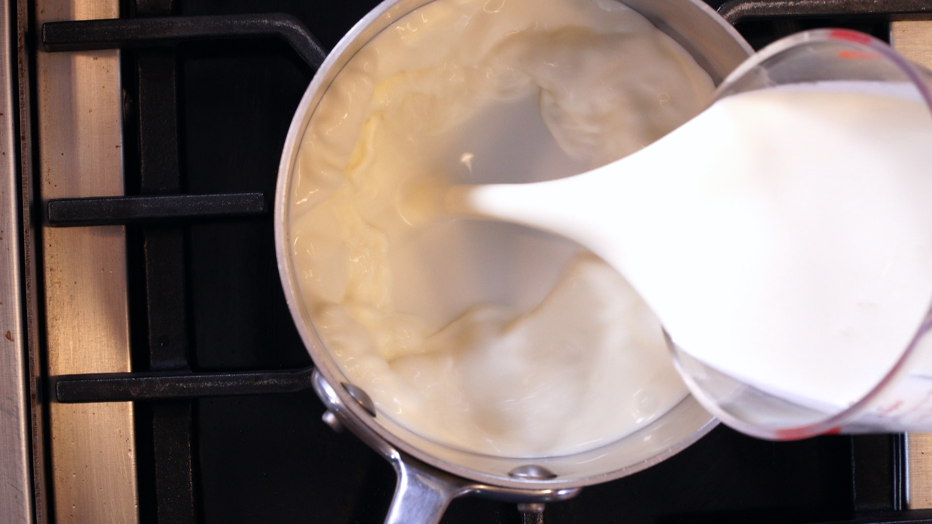 Pouring Heavy Cream into Pot