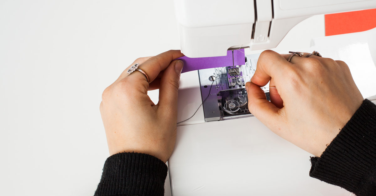 #CraftSavvy Tip No. 14: Make threading your machine needle easier by placing a piece of colored paper behind the eye.
