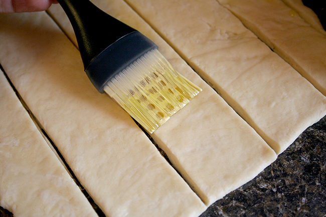 Cut dough, brushed with butter