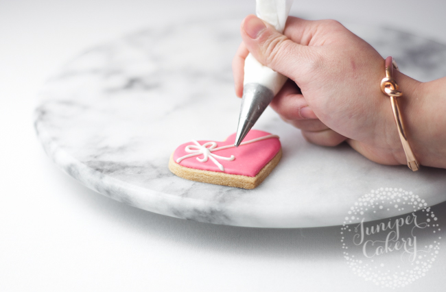 How to hold a piping bag with royal icing