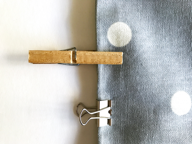 Clothespins and Binder Clip on Fabric