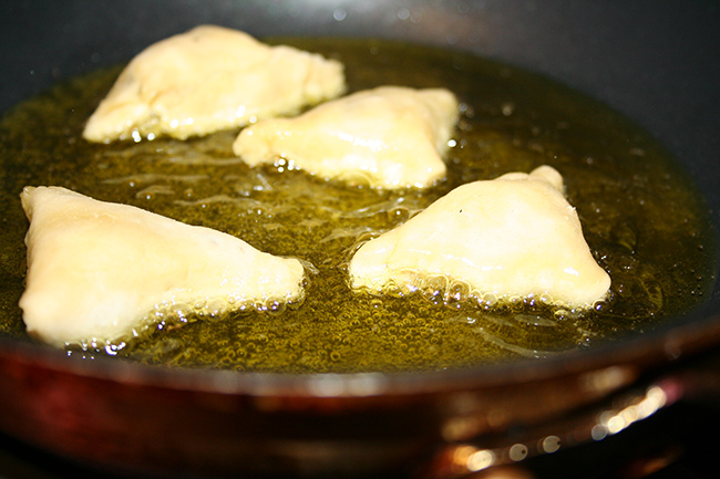 Frying samosas