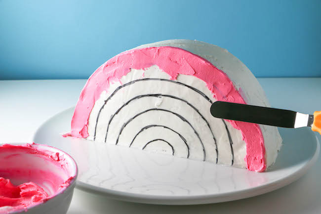 Pink Frosting on Rainbow cake