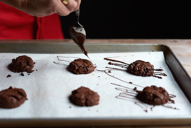 Drizzling chocolate on cookies