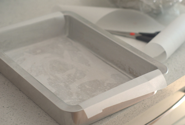 Lining a pan with parchment paper