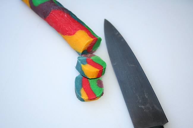 Rainbow cookies being sliced