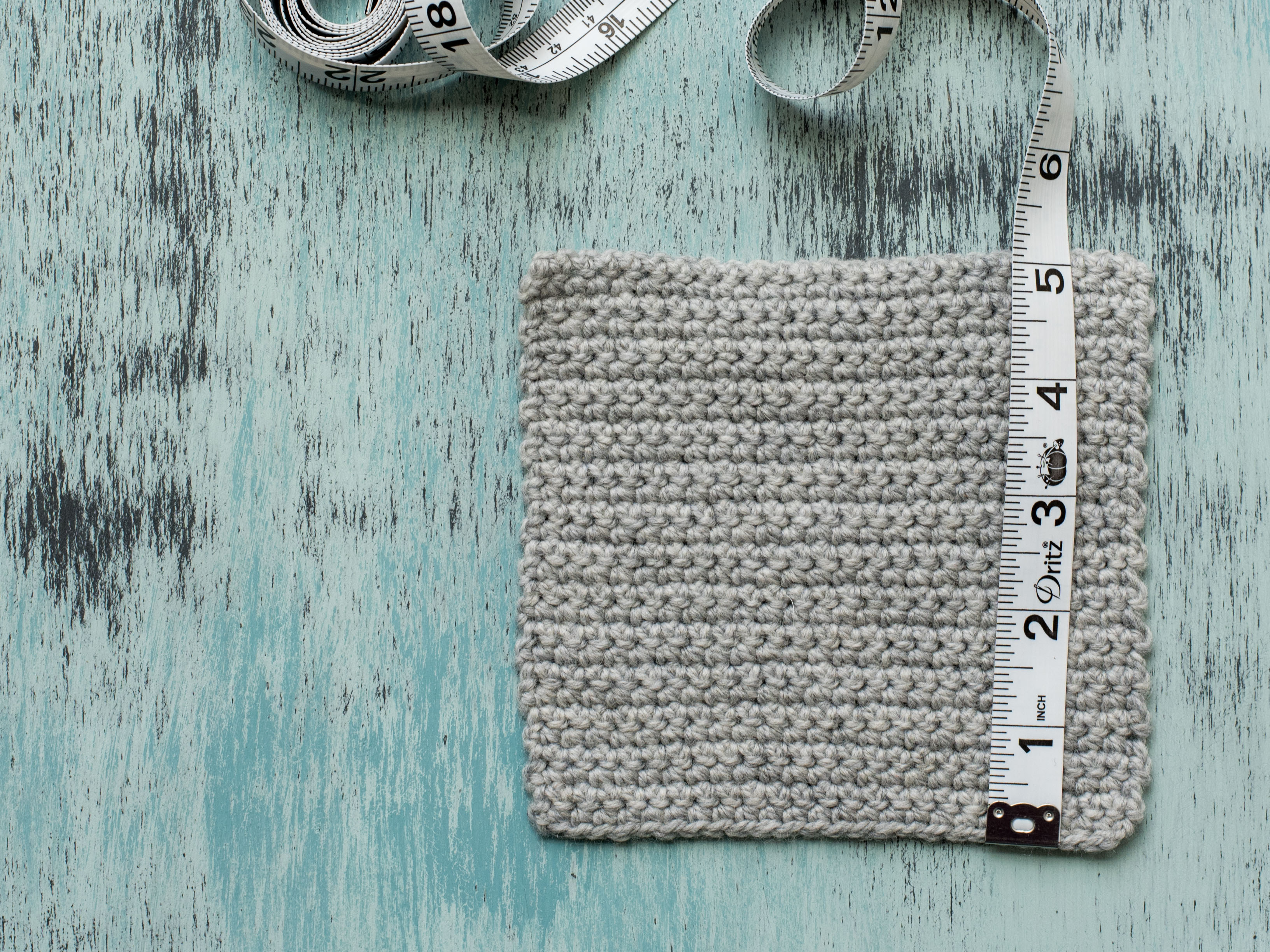 Measuring Rows on Gray Crochet Swatch