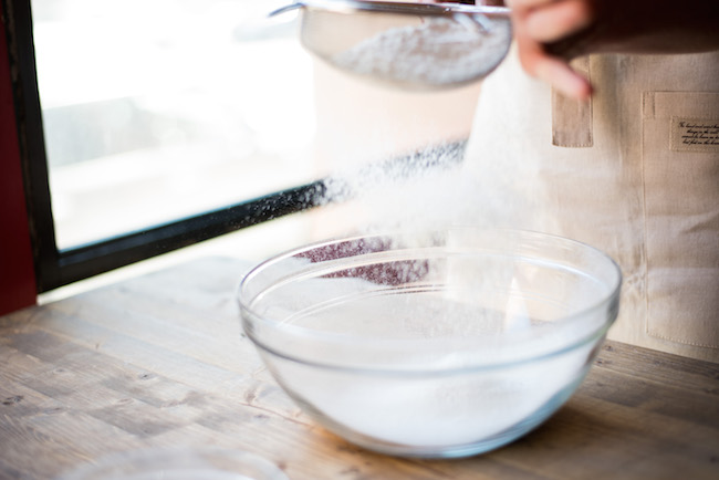 Sifting Flour in a Glass Bowl