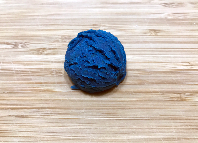 Scoop of blue cake pop dough