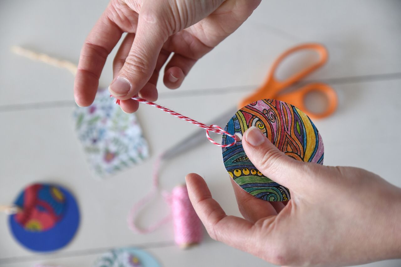 adding ties to homemade gift tag