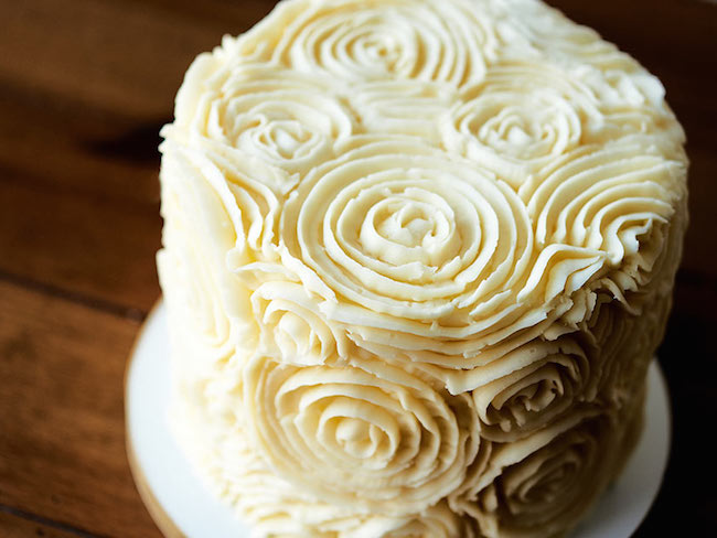 Cake covered in piped buttercream roses