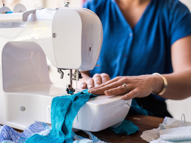 Sewing Blue Fabric at Sewing Machine