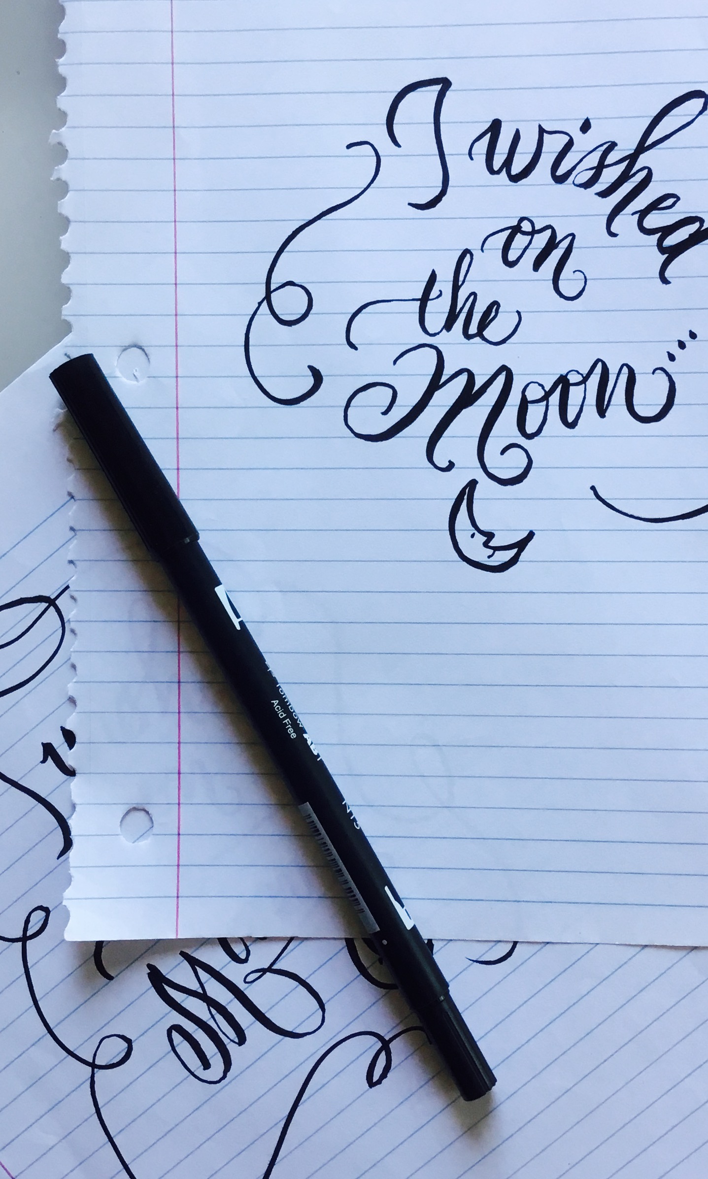 Brush calligraphy on notebook paper