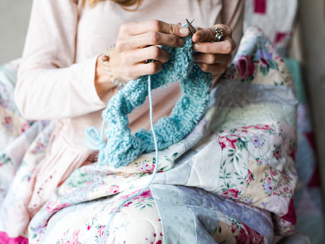Knitting While Wrapped in a Quilt