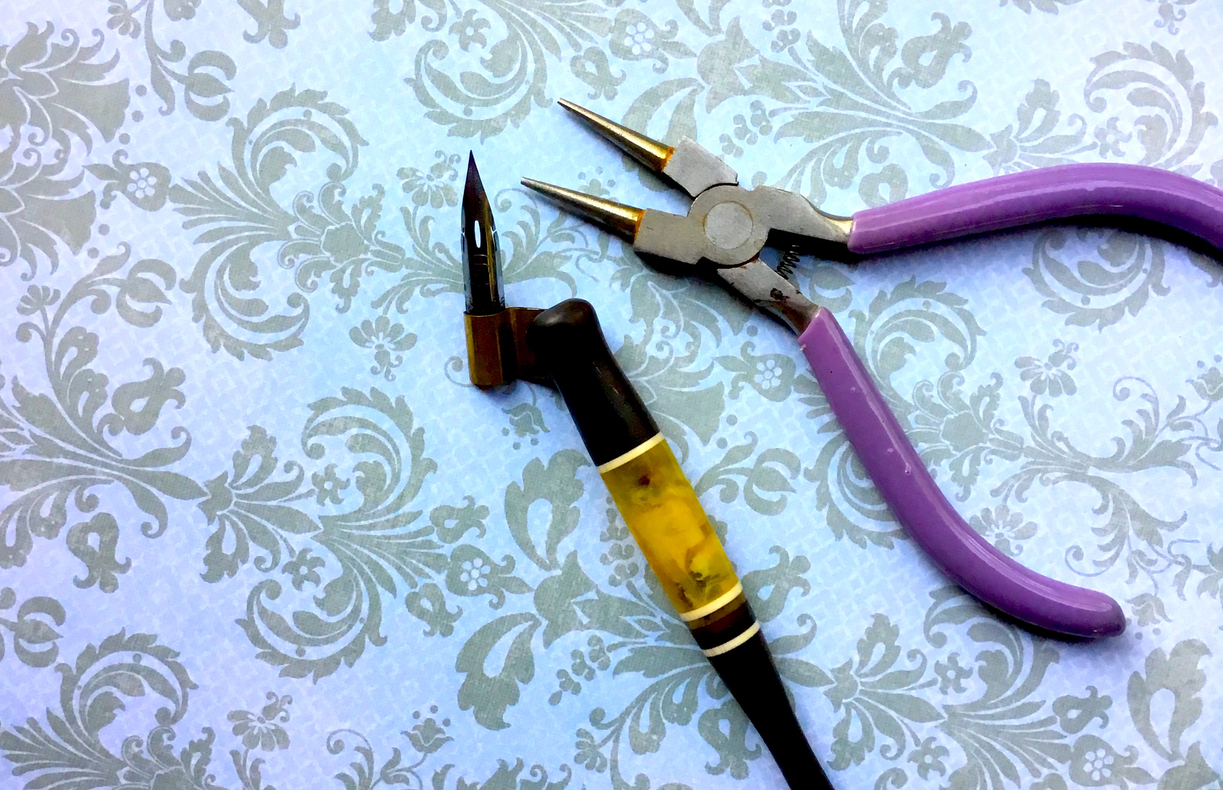 metal pen holder with oblique nib and pliers