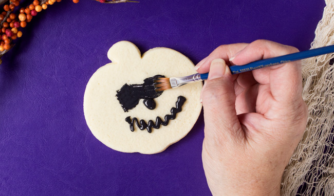 jack-o-lantern cookies with royal icing