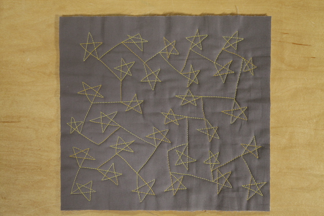 Quilted Stars on Gray Fabric