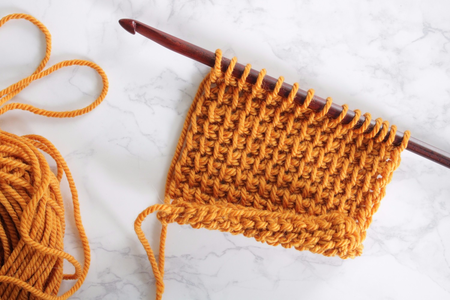 Yellow tunisian crochet swatch with bumps