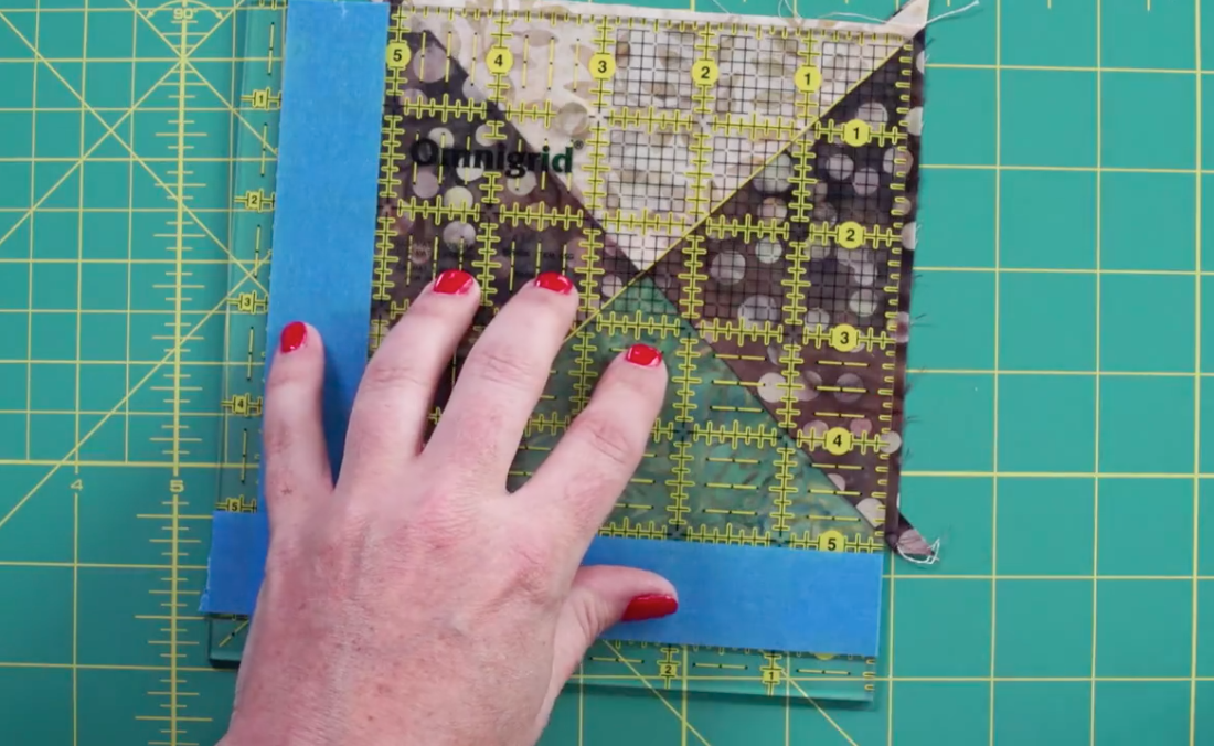 Aligning quilt block with marked ruler