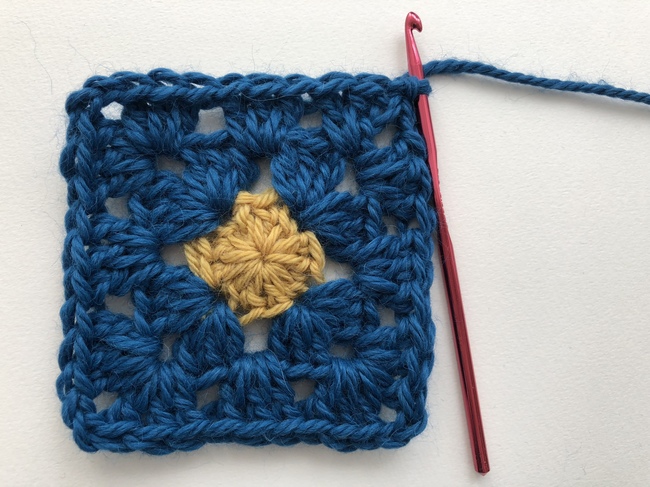 small circle inside crochet granny square