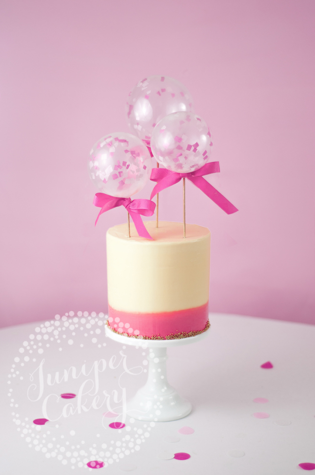 DIY mini balloon cake toppers in fondant covered cake