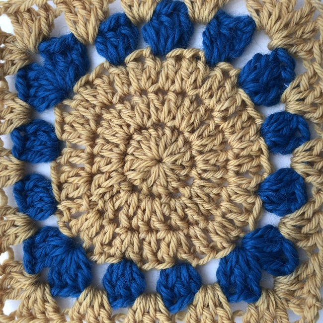 five round crochet granny square witch circle in center