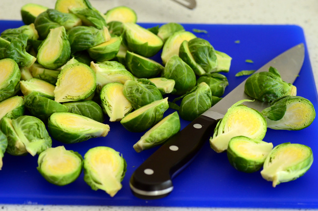 Halved brussels sprouts on cutting board