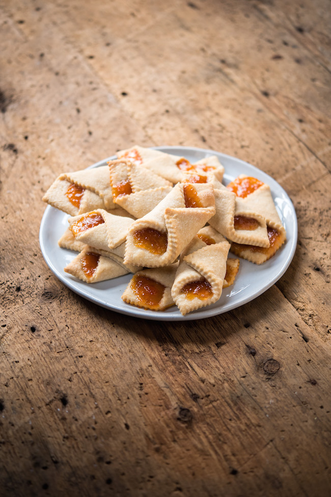 Plate of Apricot Horns on Wooden Table