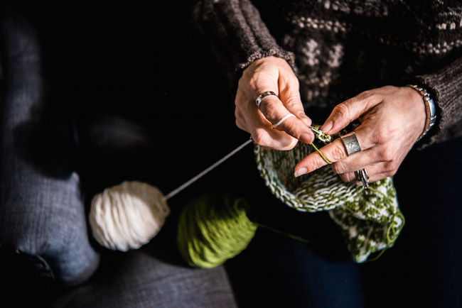 Knitting with green and white yarn