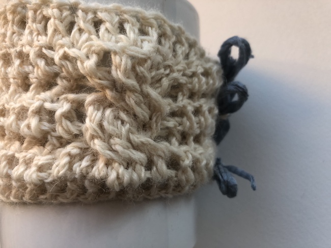cable detail on crochet cup cozy
