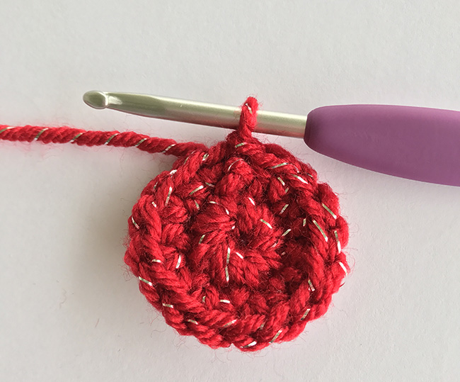 small crochet circle in red yarn