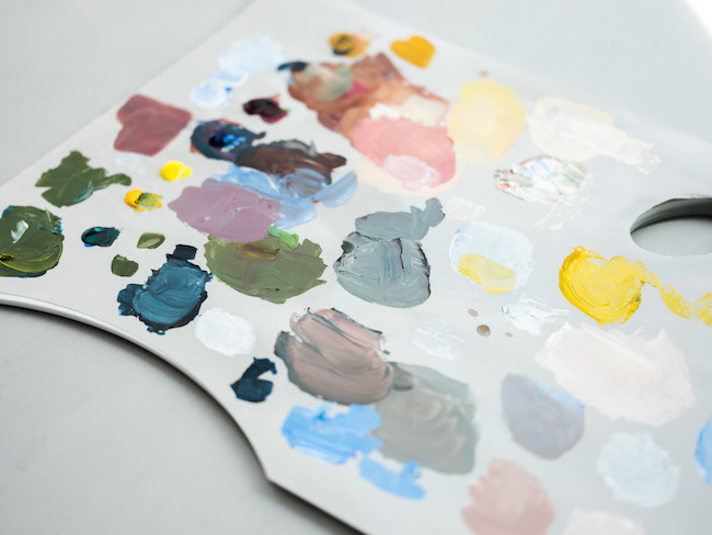 Gray Plastic Palette with Acrylic Paint Splotches