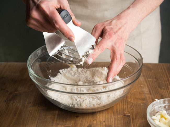 Grating butter into flour